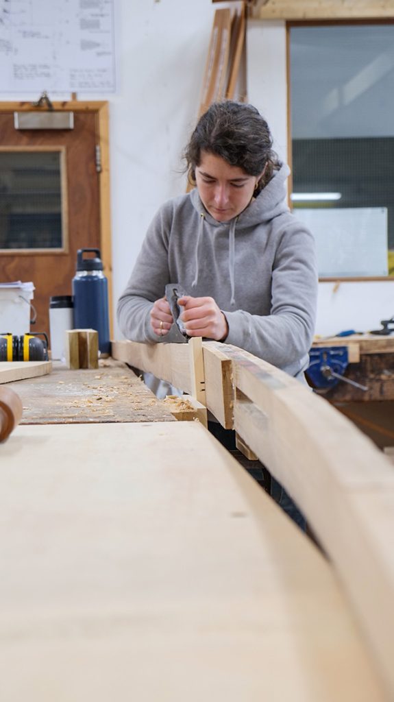 A woman working on a boat